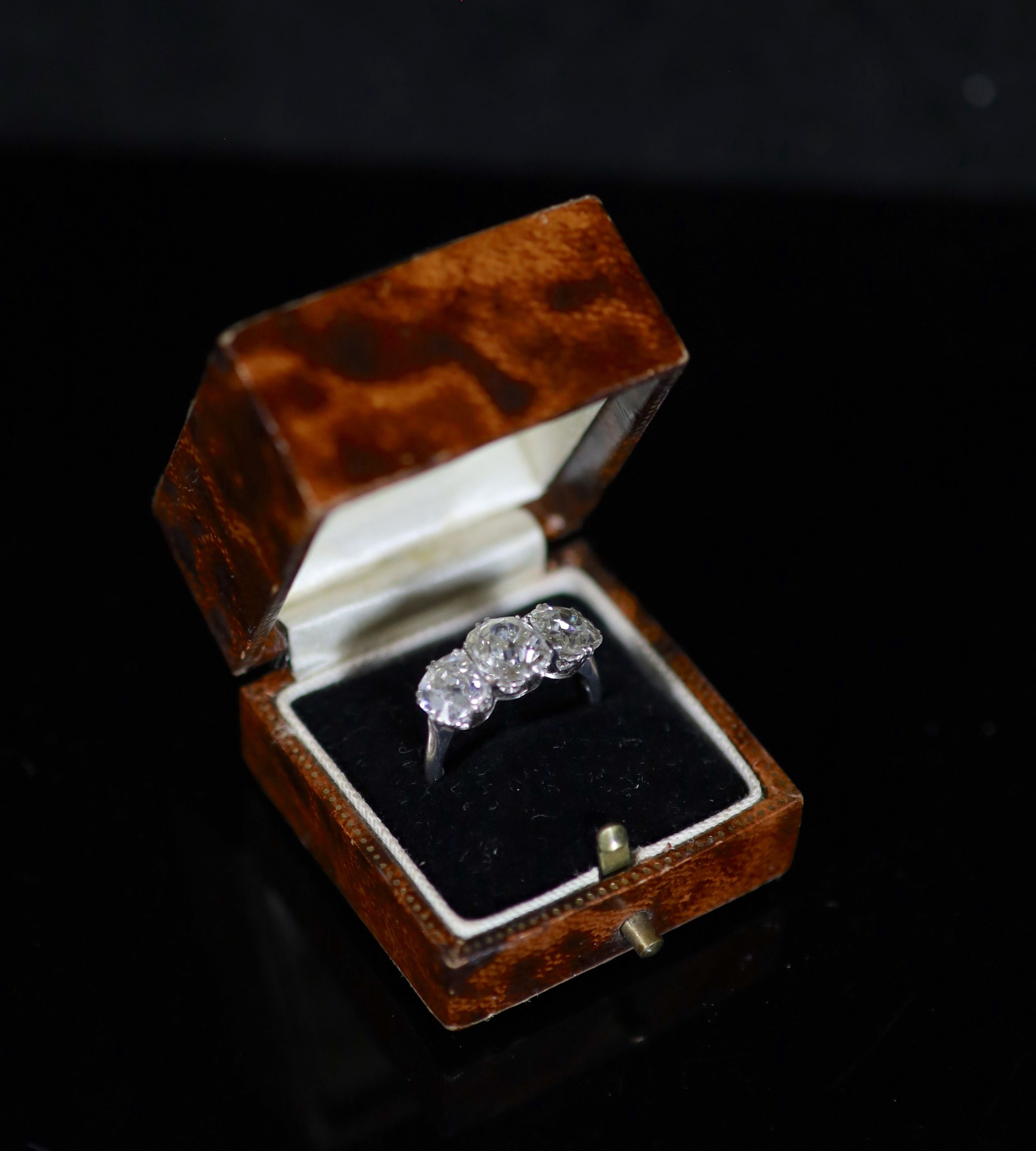 A platinum? and three stone diamond ring